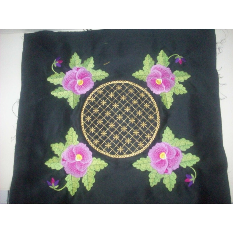 Floral machine embroidered on black center block in 14 inch quilt block - My wife's work