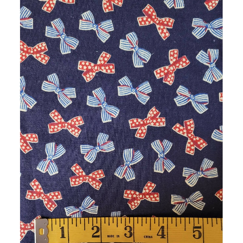 Quilting cotton bows on navy 1 1/2 yards